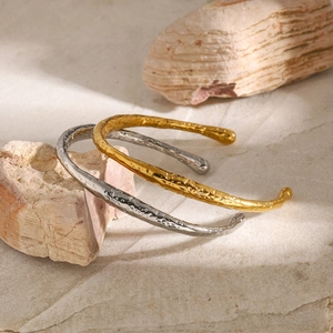 Irregular 18k gold and silver stainless steel open bangles with hammered texture