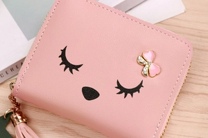 Pink cartoon PU leather coin purse with tassel zipper and metal bow detail