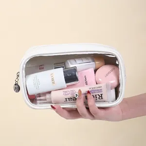 Transparent PVC makeup bag with white trim and large capacity for travel storage