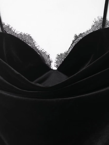 Detailed macro view of black eyelash lace trim on premium velvet fabric texture