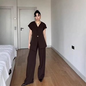 Women's chocolate brown two-piece set featuring V-neck short sleeve vest and wide leg pants