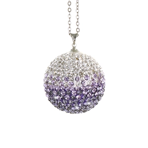 Close-up of sparkling crystal car pendant with gradient purple and white rhinestones