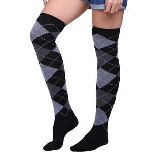 Detailed close-up of knitted diamond pattern texture on black and grey over-knee socks
