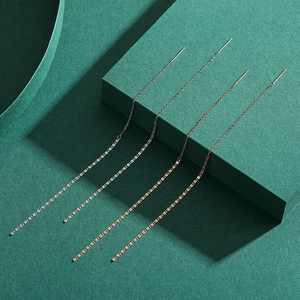 Minimalist S925 sterling silver and rose gold threader earrings on dark green background
