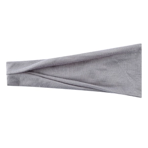 Close-up of grey elastic ribbed fabric detail on wide sports yoga headband