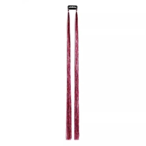Sparkly rose red tinsel hair extension with black clip on minimalist white background