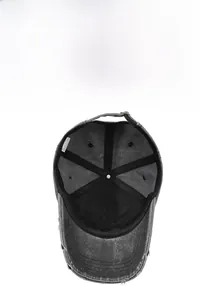 Detail of washed grey baseball cap interior showing stitching and distressed brim