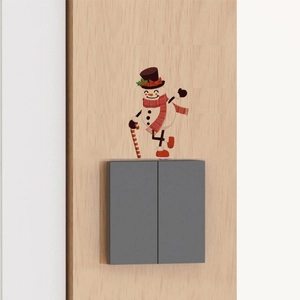 Self-adhesive watercolor snowman wall sticker next to a switch for Christmas home decor
