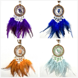 Detailed grid of dreamcatcher pendants with natural crystals and colorful feathers
