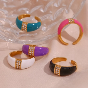 Five colorful enamel open rings in gold finish with diamonds on pink silk background
