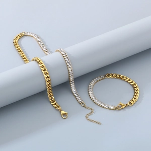 Detail of gold-plated cuban chain necklace and bracelet set with rectangular cubic zirconia