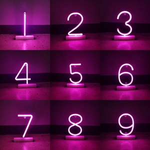 Pink LED neon number lights 1-9 set on small bases for festive party room decoration