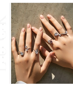 Detail of s925 silver irregular rings with water drop shaped purple gemstones