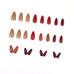 Glossy long almond press-on nails set in nude, red, and wine burgundy colors