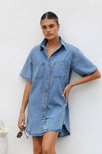 Detail of blue denim shirt dress showing lapel collar and front button closure