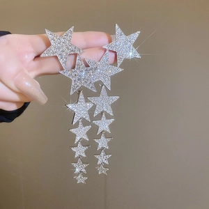 Elegant silver tassel star earrings with sparkling rhinestones in a long drop style