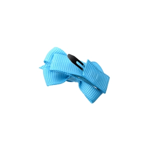 Detail of light blue grosgrain ribbon bow hair clip with silver metal snap fastener