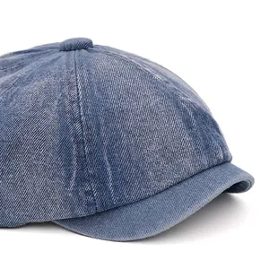 Deep blue denim newsboy cap with curved foldable brim and retro washed finish