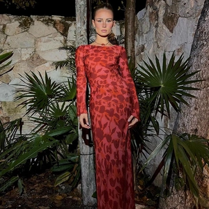 Detail of red floral print long sleeve maxi dress showing fabric texture and fit