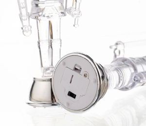 Detailed base view of clear nutcracker with battery slot, switch, and CE mark