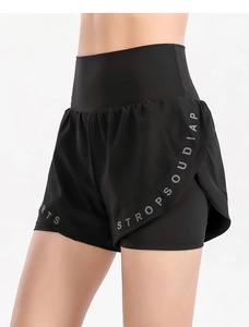 Close-up of side view of black 2-in-1 high waist sports shorts with printed lettering