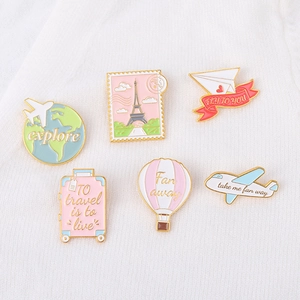 Set of 6 cartoon travel enamel pins including airplane, hot air balloon and suitcase
