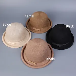 Women's lightweight knit cloche hats with bow detail in beige, camel, black, and khaki