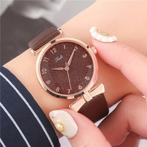 Women's quartz watch with brown PU leather strap and rose gold bow accent on the case