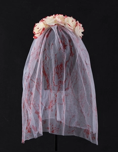 Close-up of Halloween ghost bride veil with red blood splatters and rose floral crown