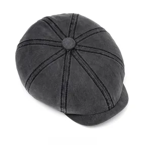 Top view of washed cotton newsboy cap in dark grey with classic eight-panel crown design