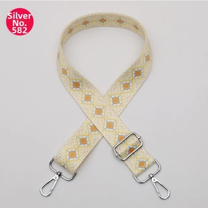 Detail of wide woven shoulder strap No. 582 with silver buckles and geometric patterns