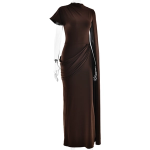 Detail of a brown one-shoulder maxi dress featuring asymmetrical pleats and cape style