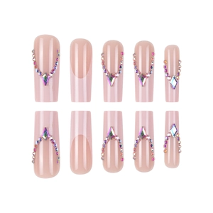 Pink French press-on nails in long coffin shape with rhinestones and colorful crystals