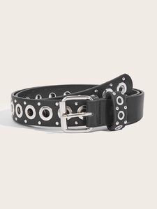 Detail of black leather punk belt with silver square buckle and metal eyelet studs