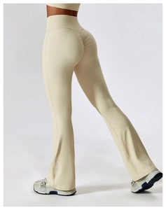 Detailed back view of high-waisted beige flare yoga pants featuring scrunch butt design