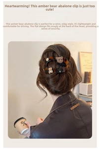 Detail of tortoise shell claw clip with velvet bear and black bow in hair