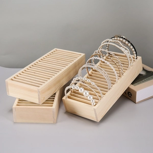 Vertical wooden headband organizer with multiple slots for hair accessories display
