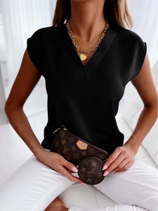 Detailed view of the elegant black V-neck slim fit sleeveless shirt on a female model