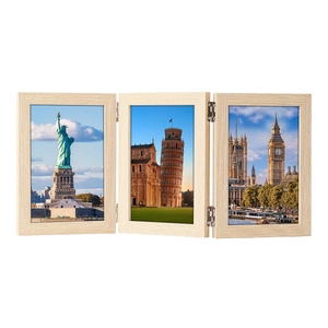 Close-up of triple folding wooden photo frame with metal hinges and scenic landscape inserts