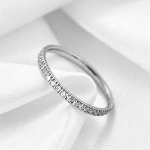 Classic 2mm stainless steel ring with a single row of sparkling round zircons on white silk