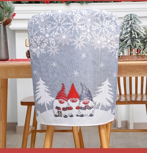 Detail of Christmas chair cover with gnome patterns on a linen texture background