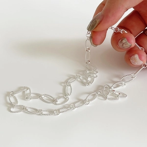 Minimalist 925 sterling silver twisted chain necklace with textured oval links in silver