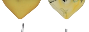 Detail of heart-shaped Christmas ornaments with matte and glossy gold plated finishes