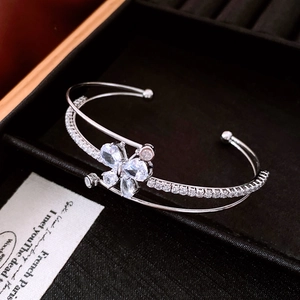 Detail of silver double-layered cuff bracelet with zircon butterfly on a black velvet box