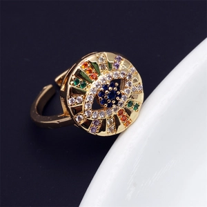 Detailed macro view of gold-plated evil eye ring with multi-color micro-set zircon stones