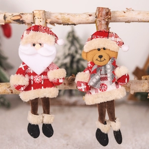Plush Christmas hanging ornaments featuring Santa and reindeer on a natural birch stand