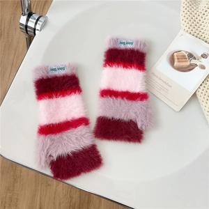 Detail showing the colorful striped plush knit texture of these fingerless winter gloves