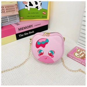 Pink cartoon animal crossbody bag for kids with golden chain strap on a playful background