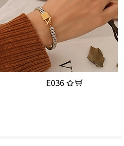 Chic 18K gold plated titanium rose necklace with T-bar toggle clasp worn over a brown sweater