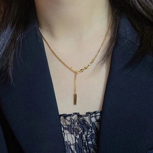18K gold plated titanium necklace with minimalist bar pendant and asymmetric chain link